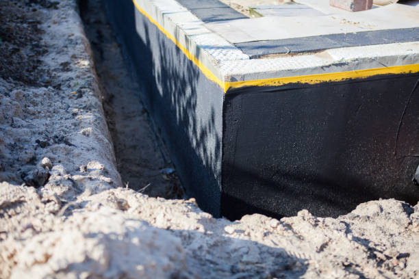 Professional Emergency Waterproofing technician working in Maryville, TN